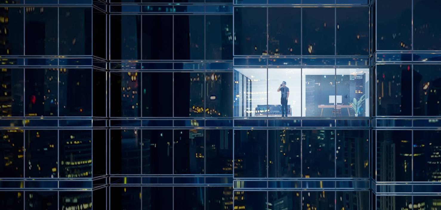 man in office building at night